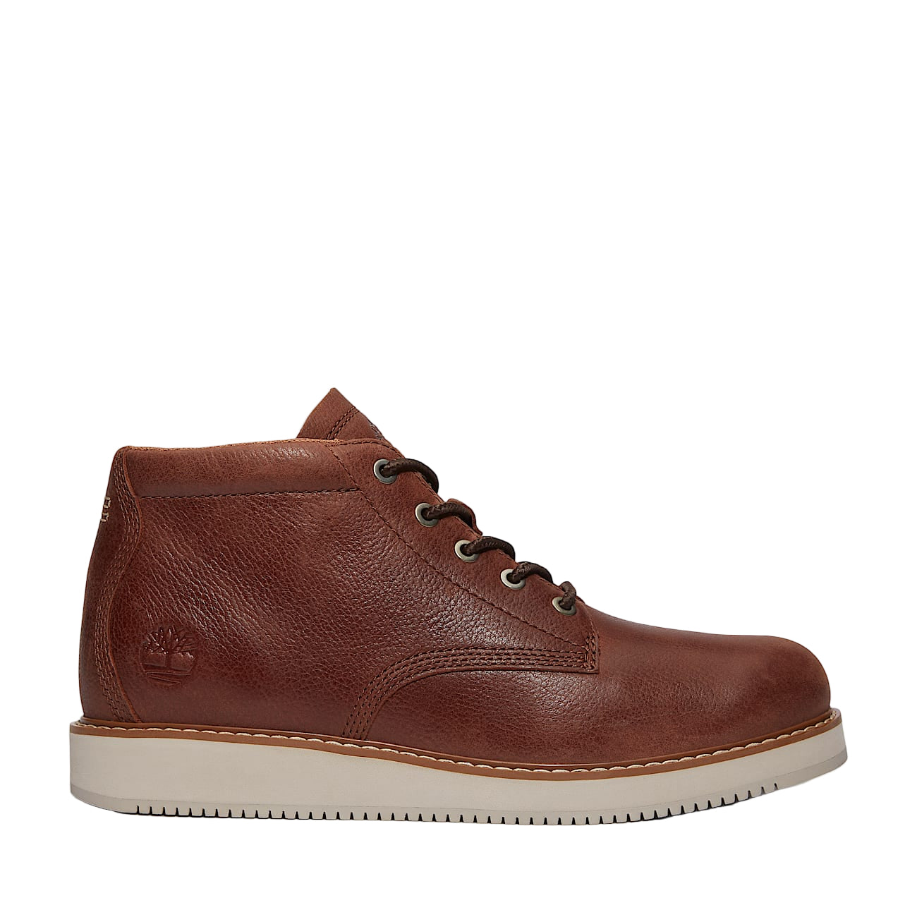 Brown leather boot with white sole on a light gray background