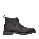 Black Chelsea boot on a light gray background