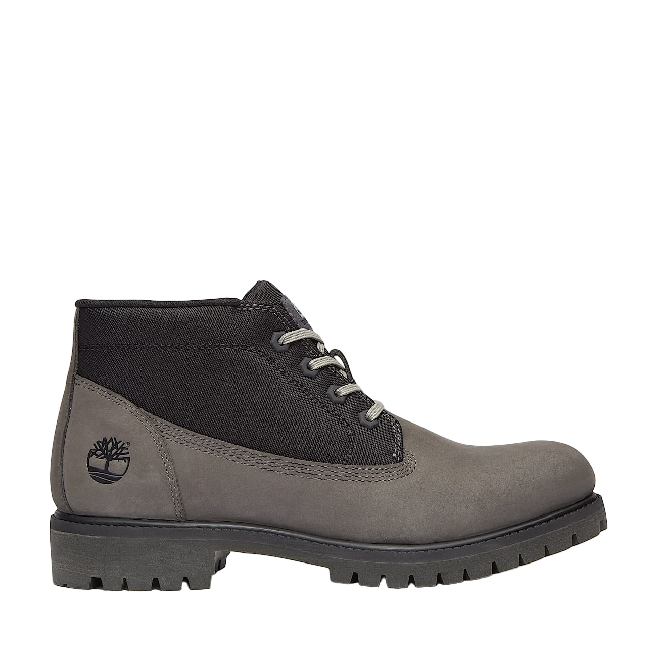 Gray and black Timberland boots on a white background