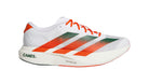 White running shoe with orange and green accents on a white background