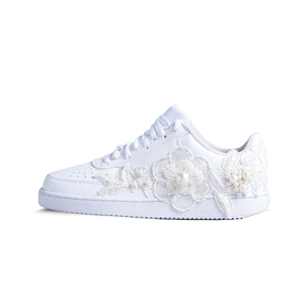 White low-top sneaker with floral lace and pearl embellishments, embroidered streetwear shoe