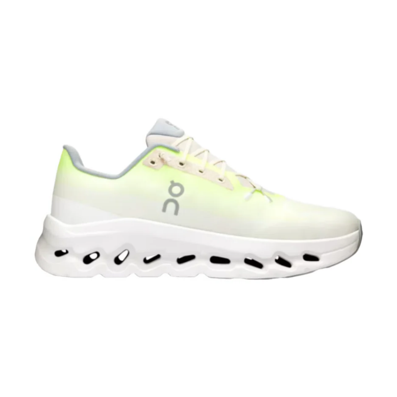 White and neon green designer sneaker with cushioned sole and mesh upper, side view