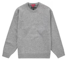 Grey crewneck sweater with ribbed cuffs and hem, Supreme tag visible at collar