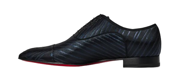 Black dress shoe with blue pattern on a white background