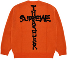 Orange knit streetwear sweater with black cross graphic and bold graffiti text on back