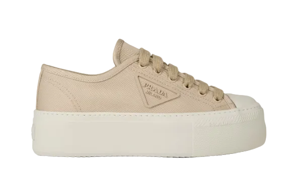 Beige sneaker with white sole on a light gray background