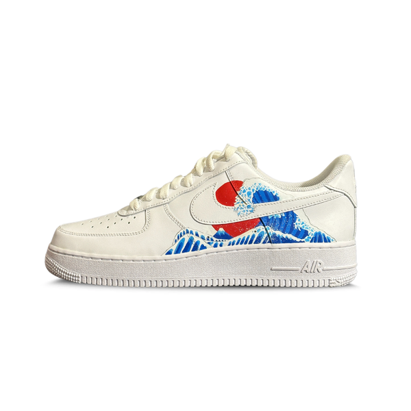White sneaker with blue wave and red sun graphic, streetwear luxury shoe on white background