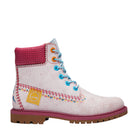 White boot with pink top and colorful stitching on a white background