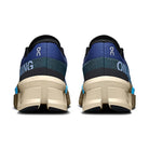 Rear view of blue and beige On running sneakers with cushioned soles and logo accents