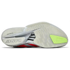 Adizero running shoe outsole with translucent grip, neon green accent, and visible branding.