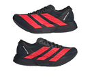 Black and red athletic shoes with quilted design on a light gray background