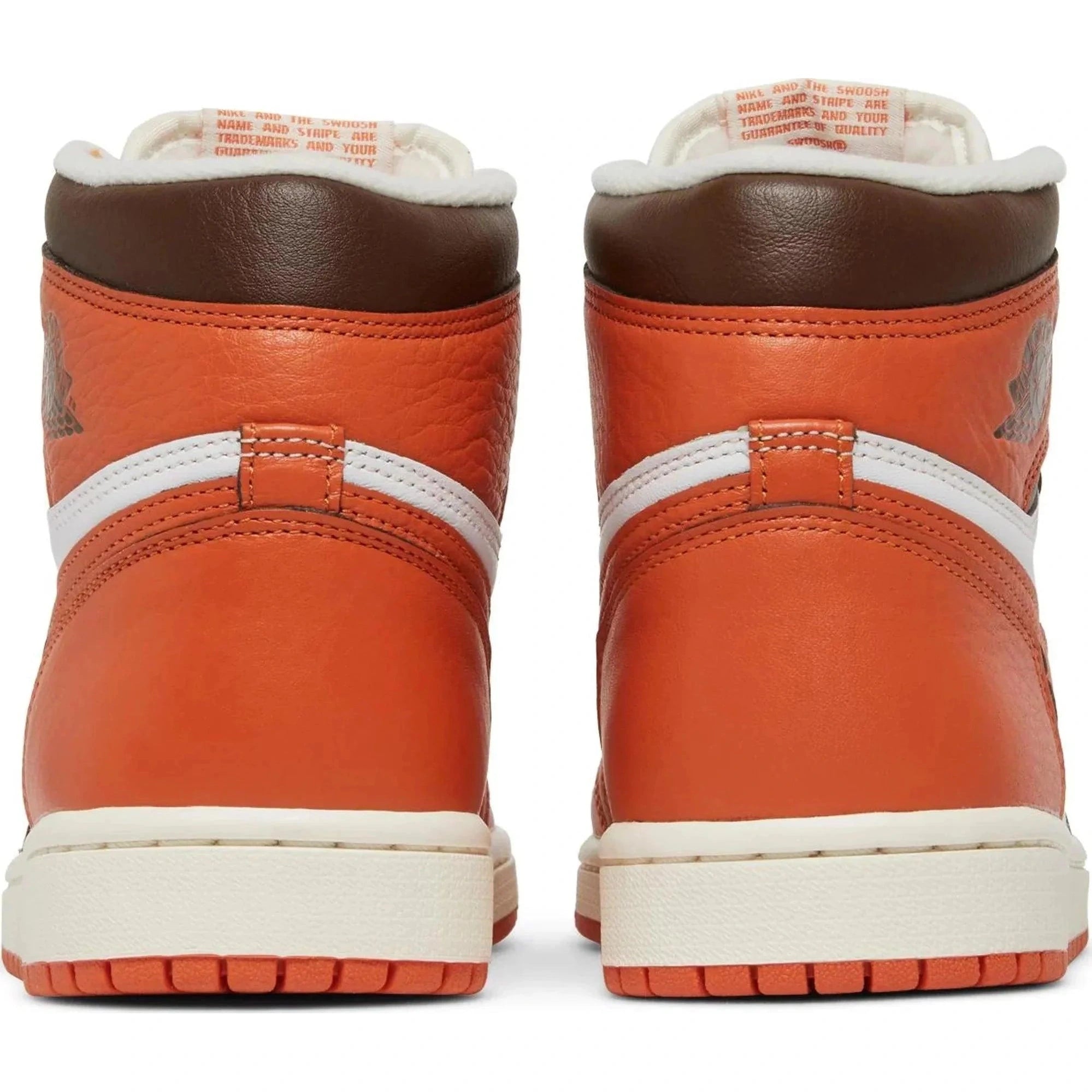 Back view of orange and brown high-top leather sneakers with white accents and textured sole