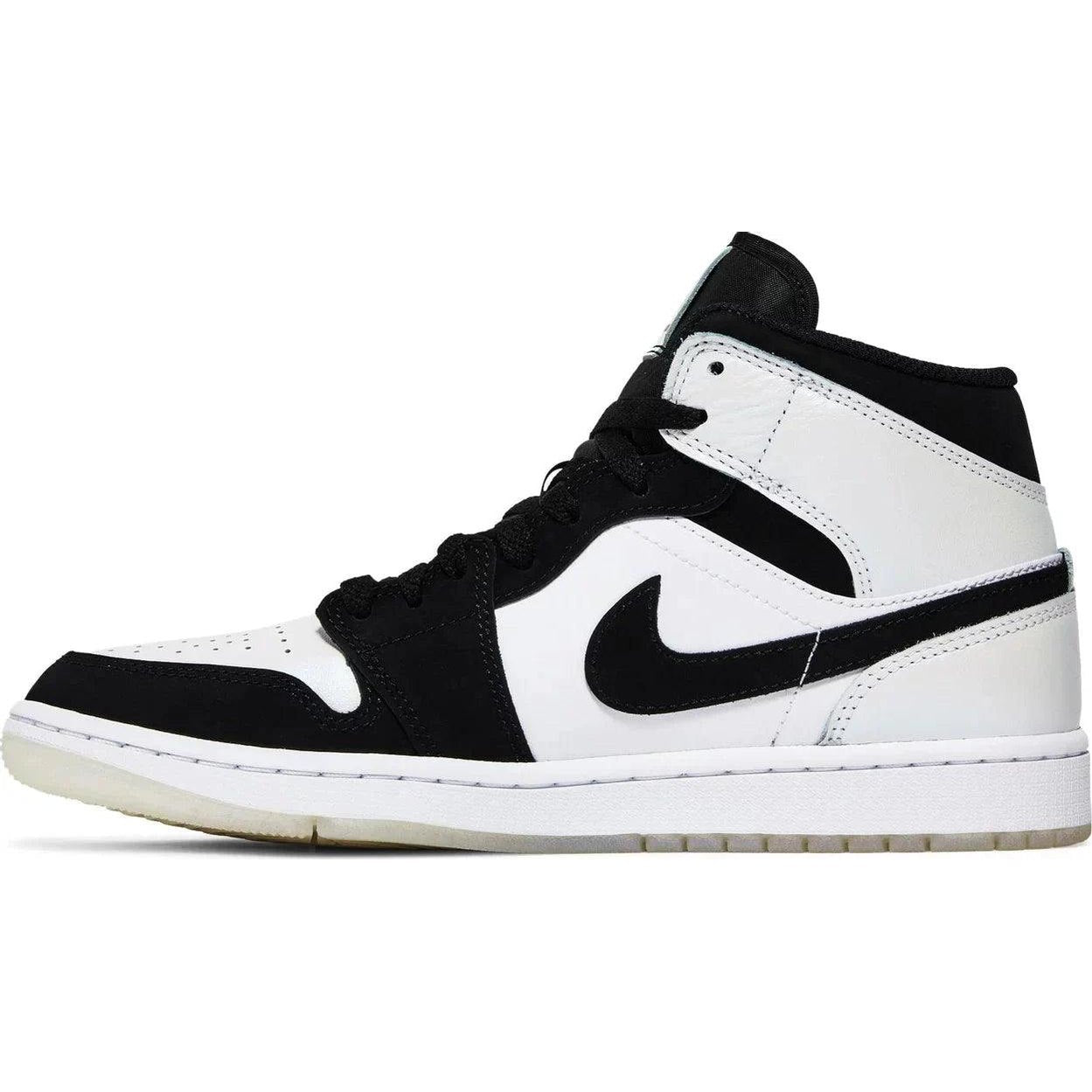 Black and white mid-top sneaker with black swoosh, streetwear style footwear