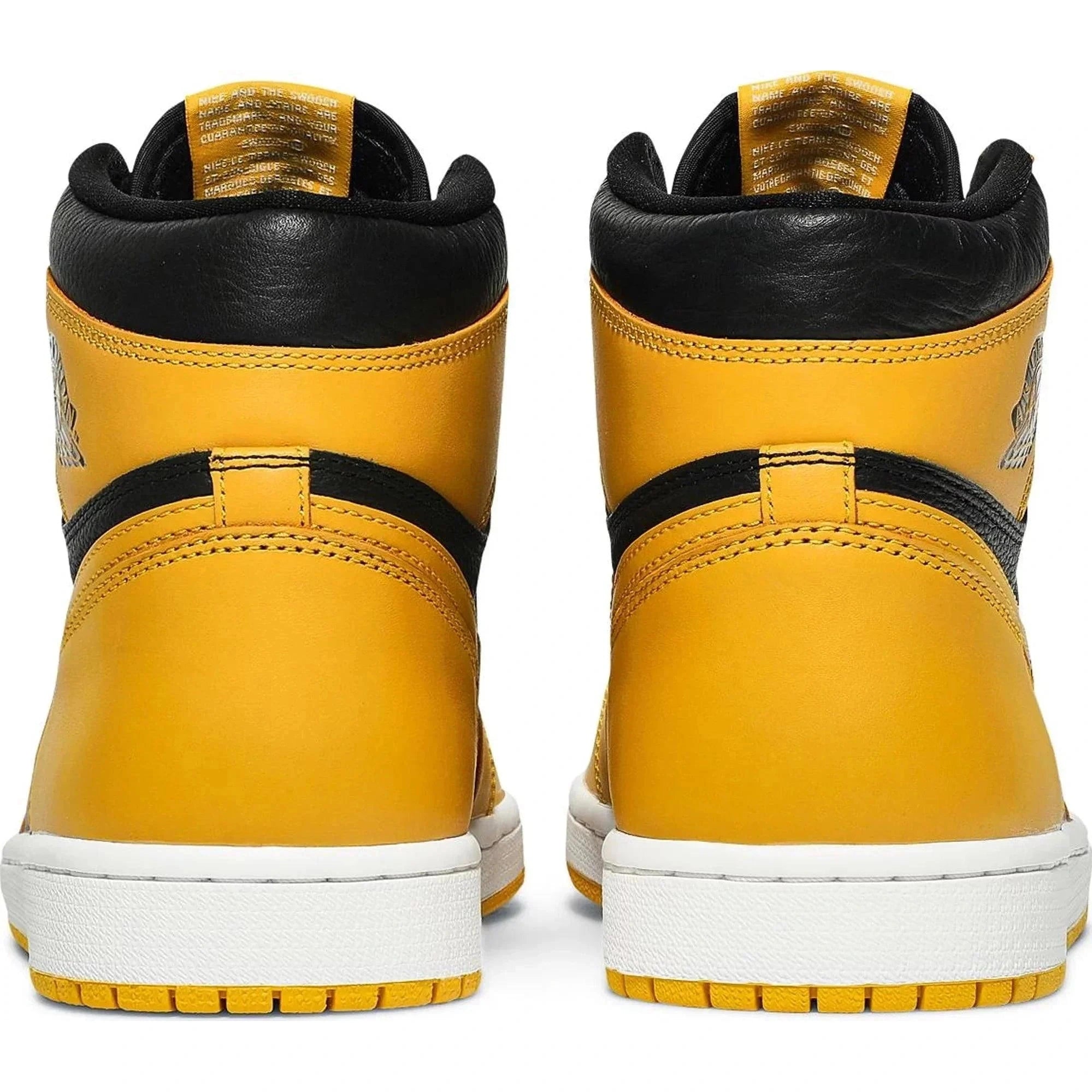 Rear view of yellow and black high-top sneakers with white soles on a white background