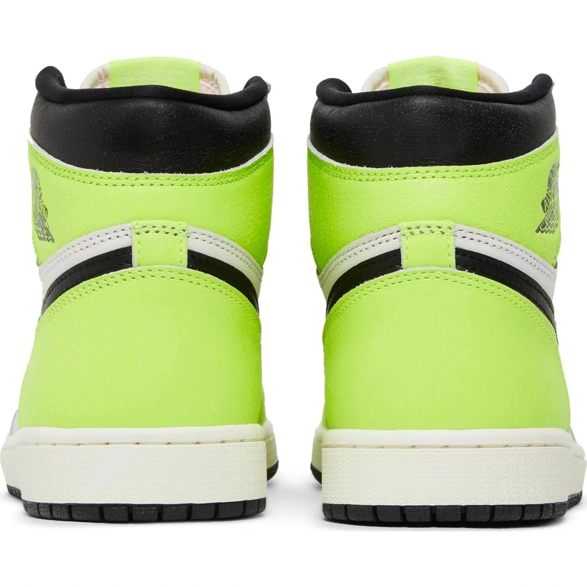 Rear view of neon green and black high-top sneakers with white midsoles, leather texture visible.