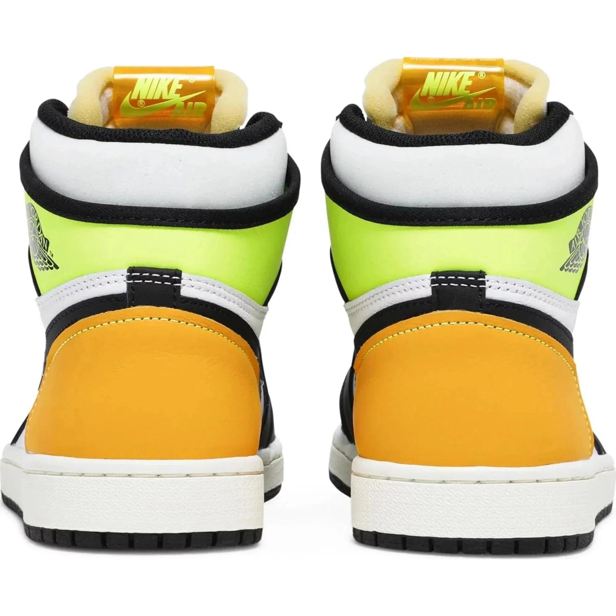 Back view of high-top sneakers with yellow, black, and volt green panels, white midsoles, and Nike Air tags