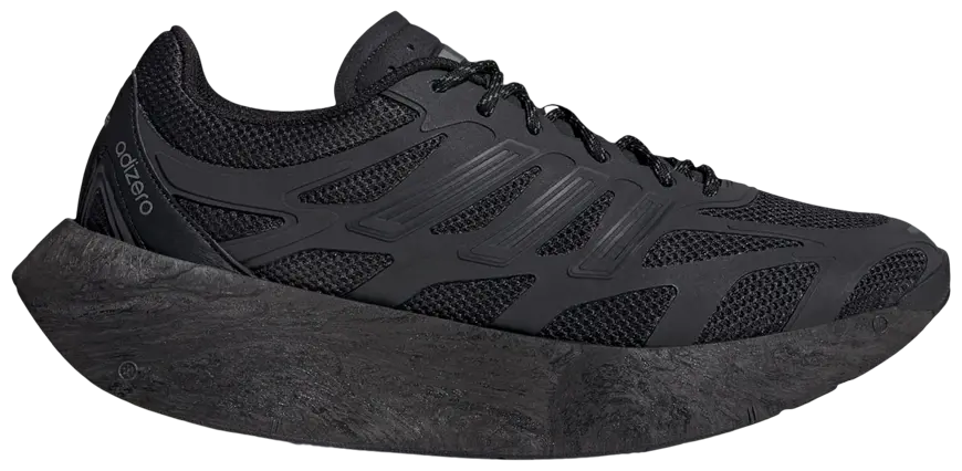 Black streetwear sneaker with mesh upper, bold textured sole, and Adizero branding