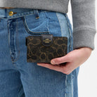 Coach Medium Corner Zip Wallet In Loved Signature Canvas Gold Brown