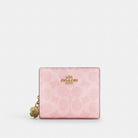 Coach Snap Wallet In Signature Canvas With Charm Gold Powder Pink