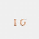 Coach Repeated C Huggie Earrings Rose Gold