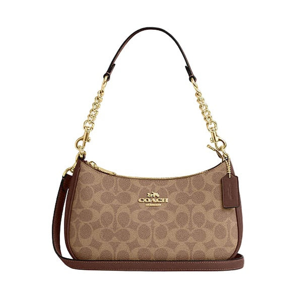 Coach handbag with gold chain strap on a light gray background