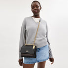Coach Klare Crossbody Bag In Signature Canvas Gold Walnut Black
