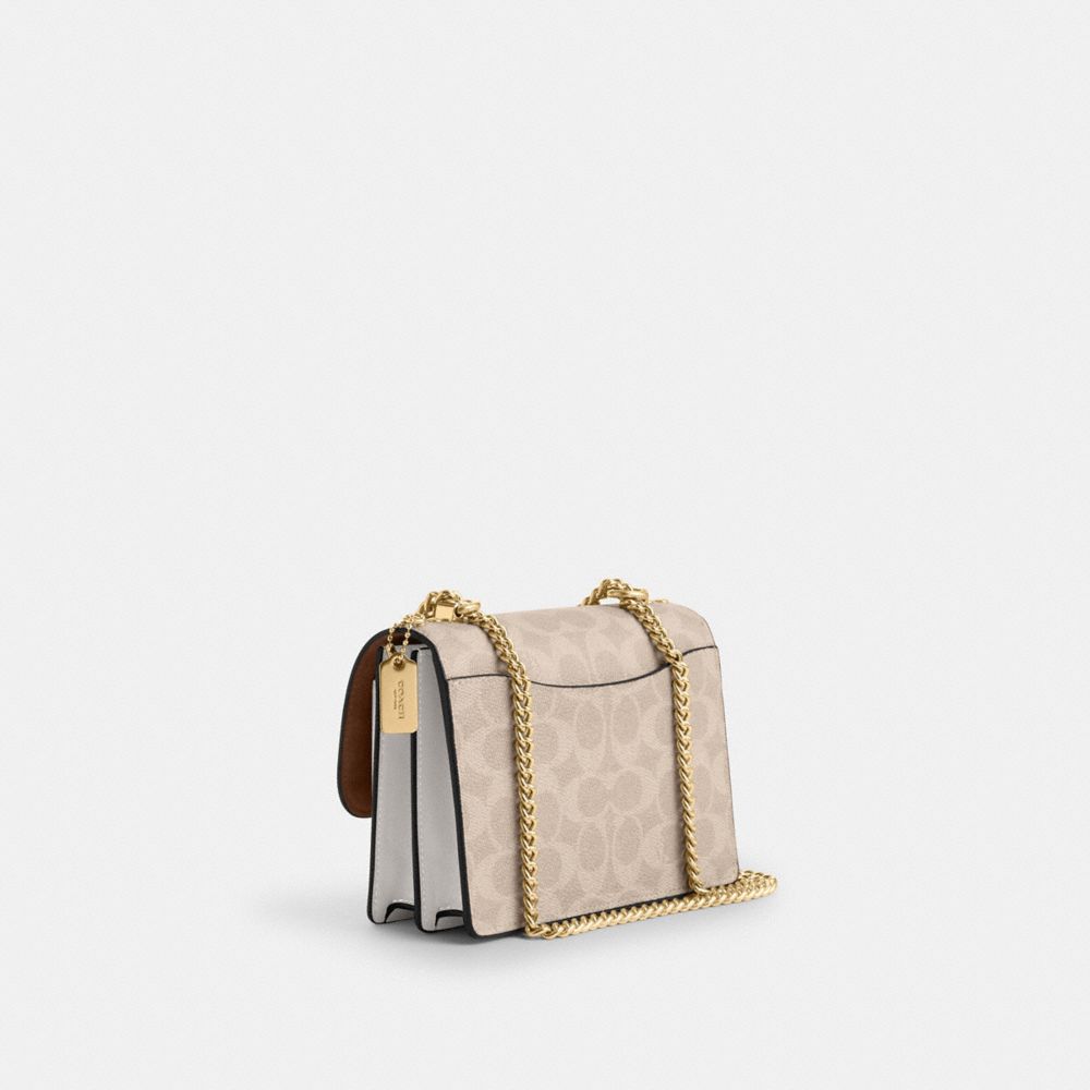 Coach Mini Klare Crossbody Bag In Signature Canvas Gold Sand Chalk