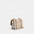Coach Mini Klare Crossbody Bag In Signature Canvas Gold Sand Chalk
