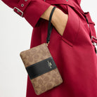 Coach Corner Zip Wristlet In Signature Canvas With Stripe Gold Tan Black