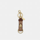 Coach Trigger Snap Bag Charm In Signature Canvas Gold Tan Brown