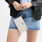 Coach Large Corner Zip Wristlet In Signature Canvas Gold White Chalk