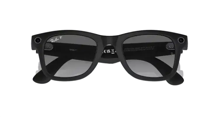 Black wayfarer sunglasses with dark lenses on a dark gradient background