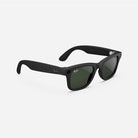 Black wayfarer sunglasses with green lenses and logo detail on the temples