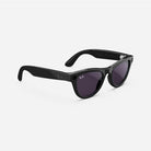 Black wayfarer sunglasses with dark lenses and visible logo on the arms, streetwear style