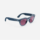 Blue round sunglasses with thick frames and purple lenses, fashion eyewear on white background