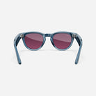 Blue acetate frame sunglasses with round purple-tinted lenses on white background