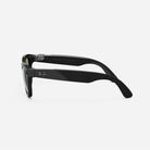 Side view of black Ray-Ban sunglasses with rectangular frames on white background