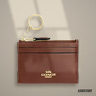 Lifestyle — Coach Mini Skinny Id Case in Gold Redwood