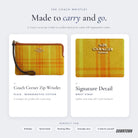 What's inside — Coach Corner Zip Wristlet In Regenerative Cotton With Plaid Print in Gold Burnished Amber