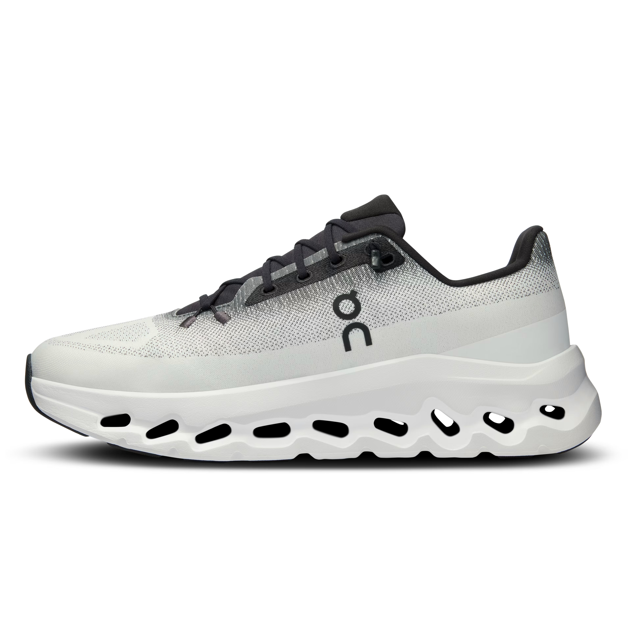Modern white and grey designer sneaker with black accents and chunky vented sole