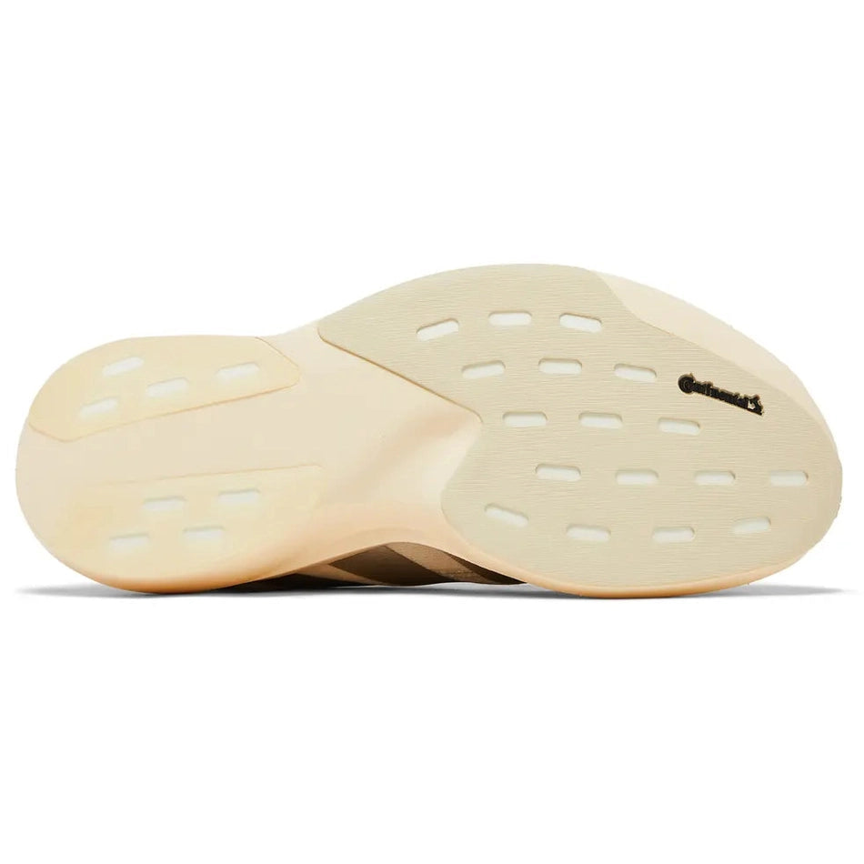 Beige sneaker outsole with textured grip and Continental branding, streetwear footwear detail