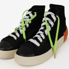 Black high top shoes and the shoelaces worn are Neon green and white gradient shoelaces on a white background