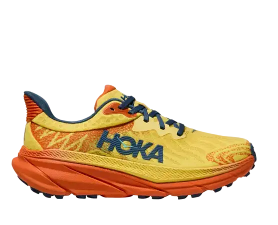 Yellow and orange Hoka running shoe with blue laces and bold side logo on a white background