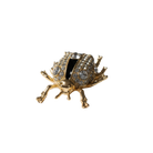 Gold insect-shaped jewelry shoe charm on a white background