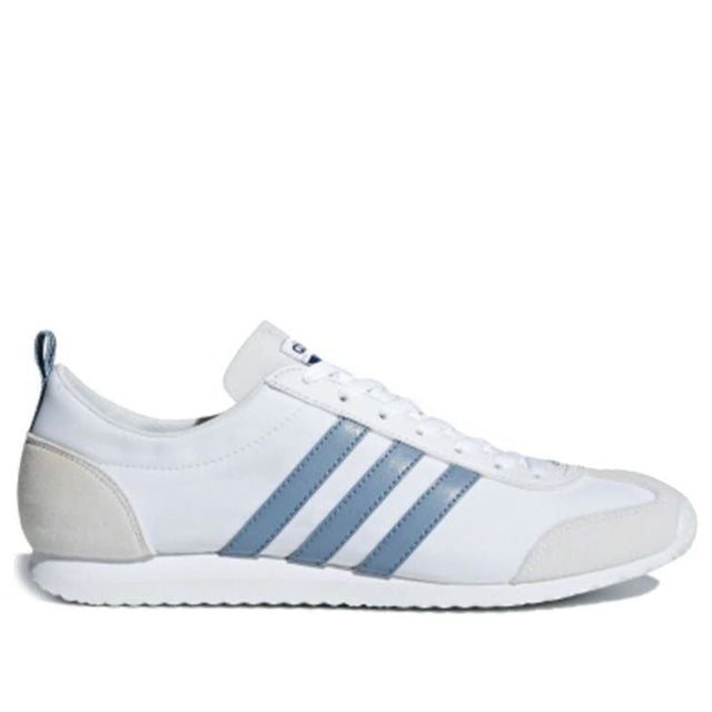 White sneaker with blue stripes on a white background