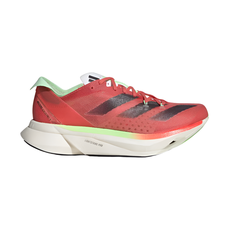 Red and green athletic sneaker with black stripes, thick white sole, side profile view