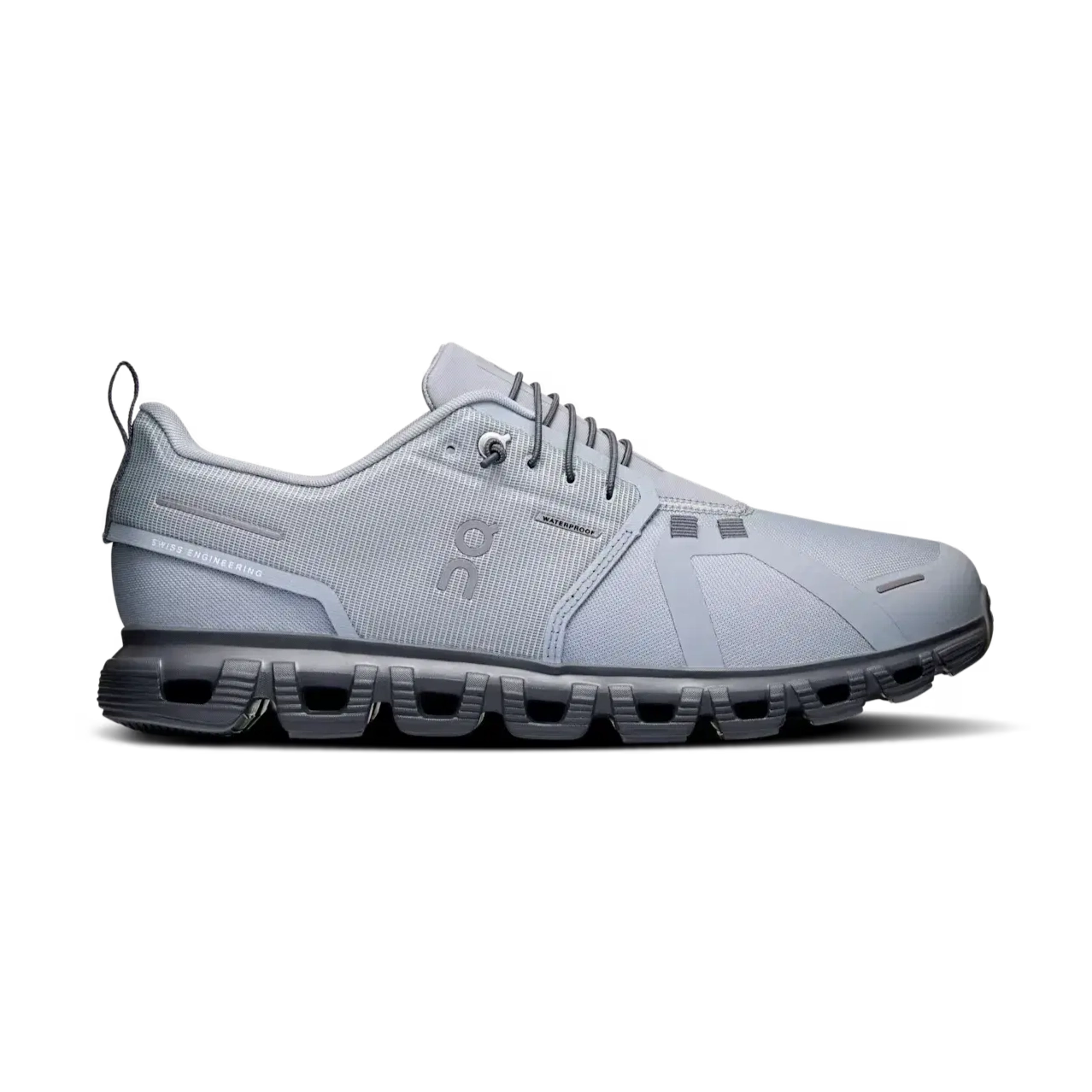 Light grey athletic sneaker with mesh upper and unique cushioned sole, side profile view