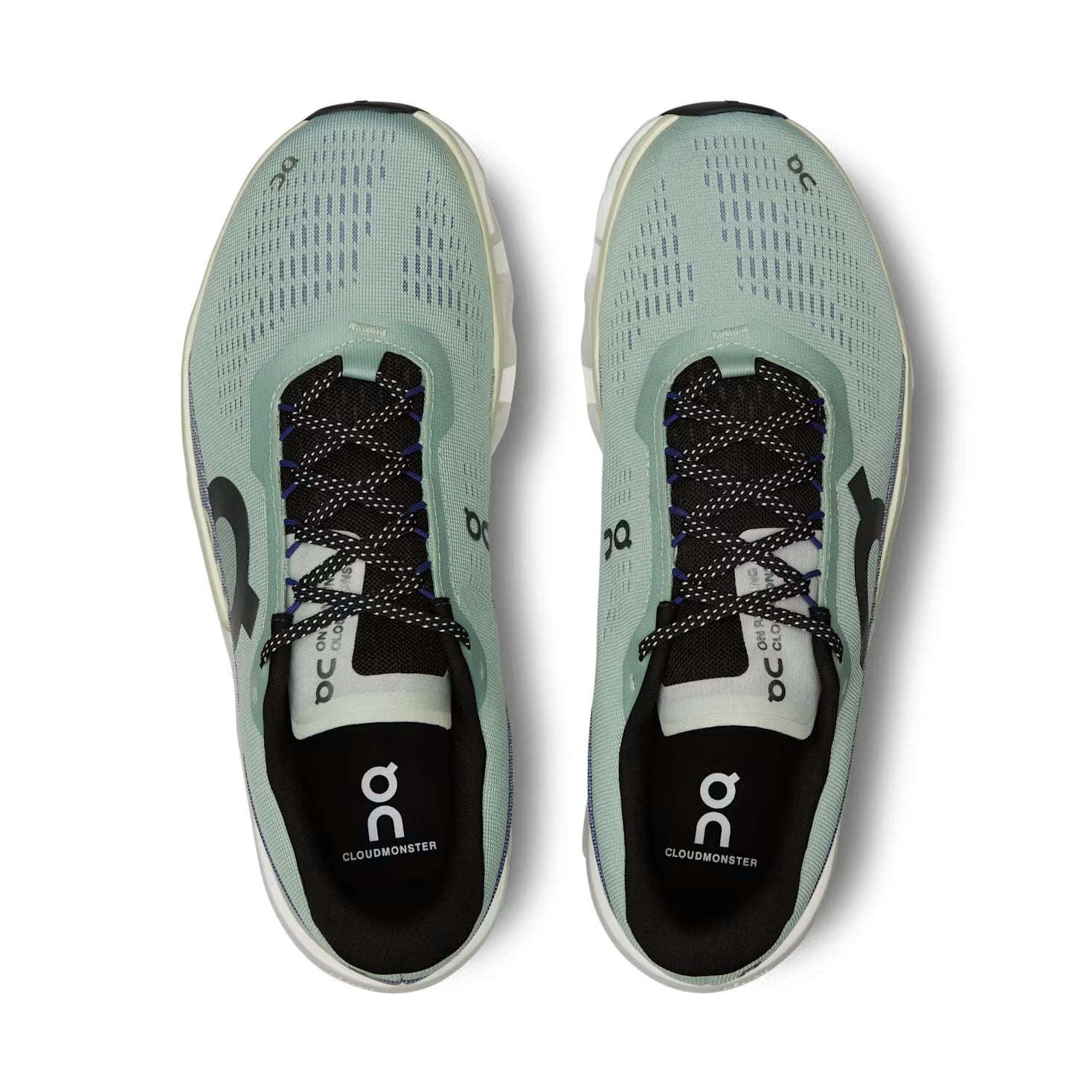 Top view of light blue On Cloudmonster sneakers with black laces and mesh uppers